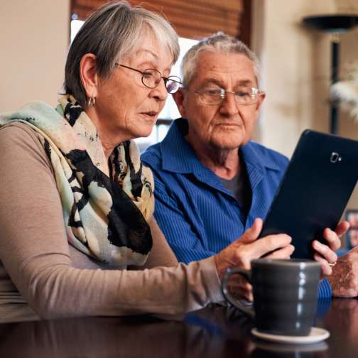 Seniors using tablet for care